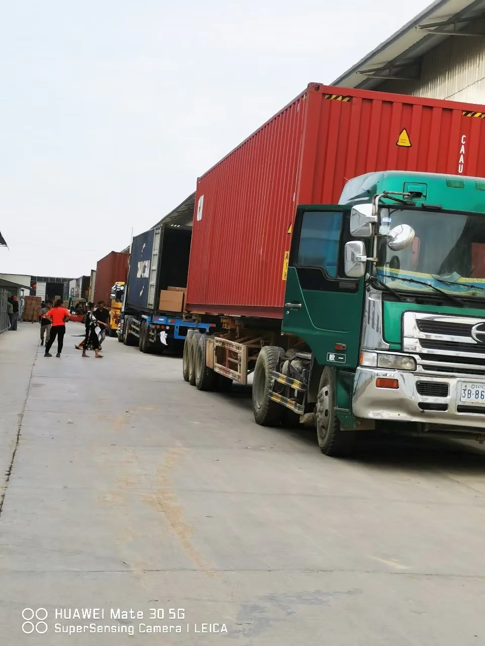 Container trucks in the factory loading area before export dispatch