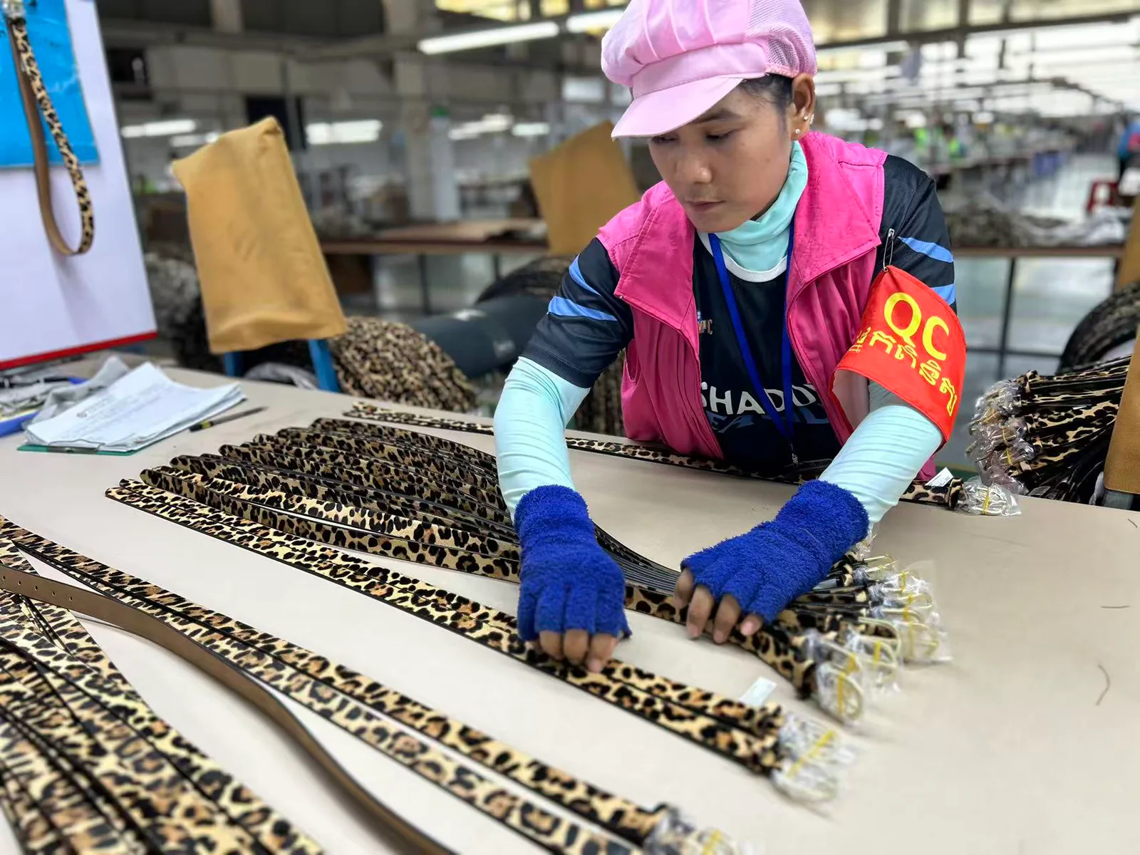 inspector checking decorative belts and hardware