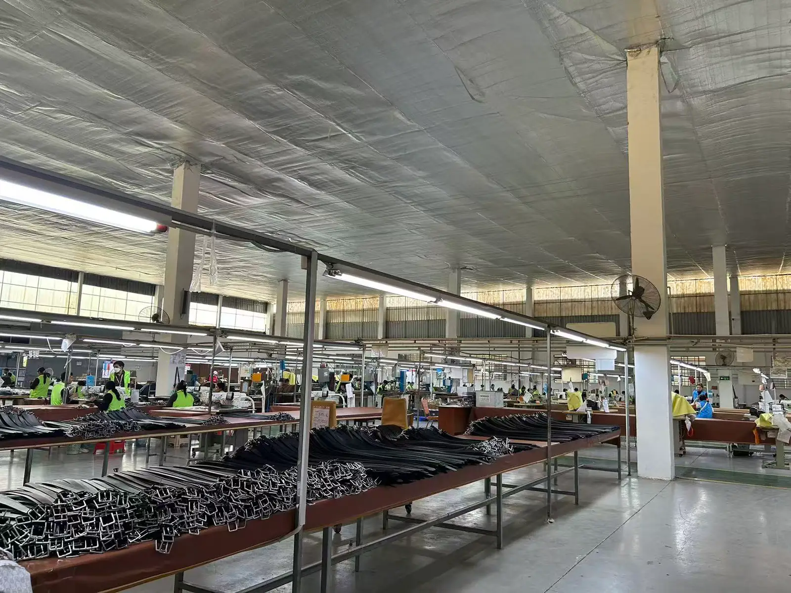 Finished belts arranged on a factory worktable