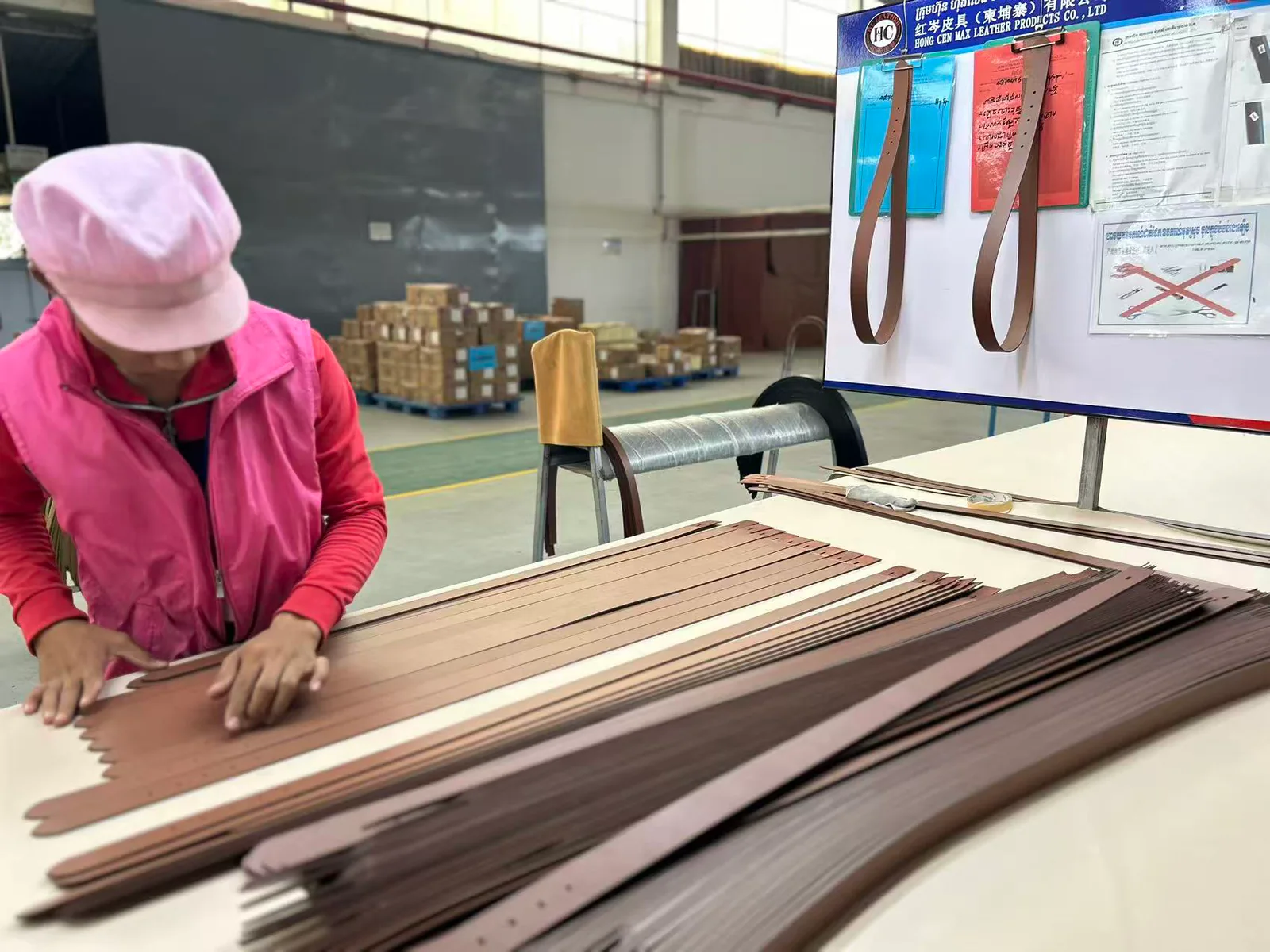 Inspector checking a belt strap during production