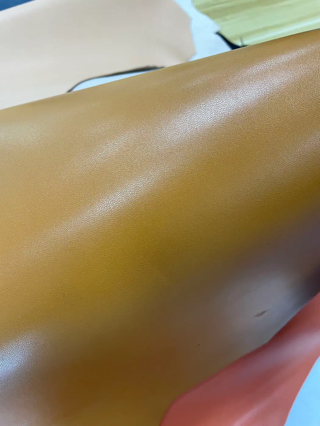 close view of a smooth colored leather surface finish