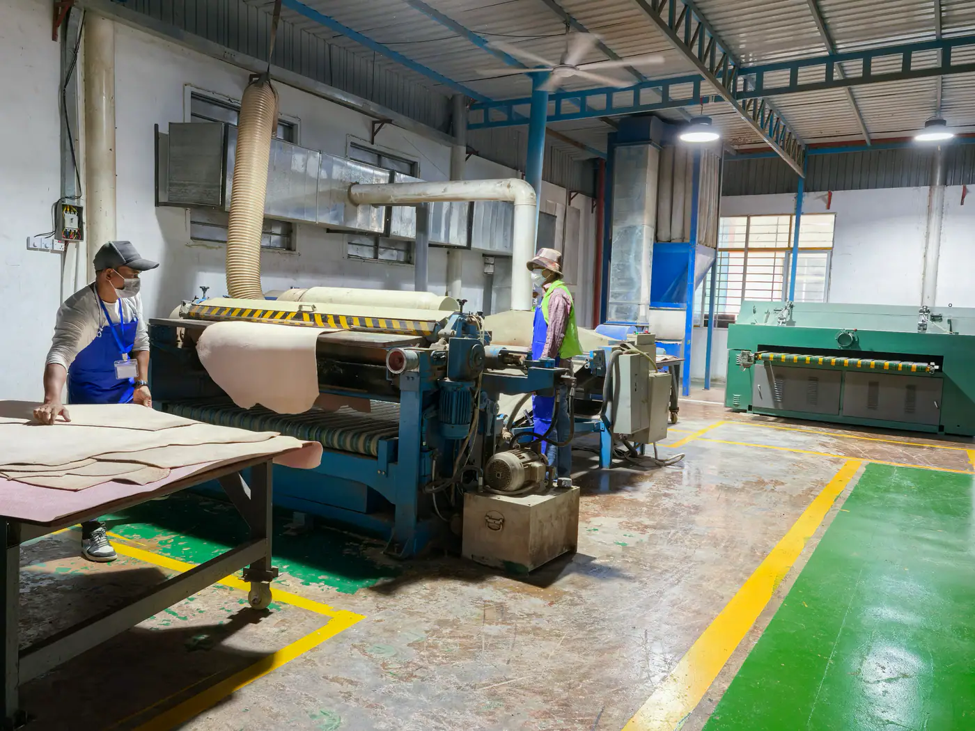Leather splitting machine in a belt material facility