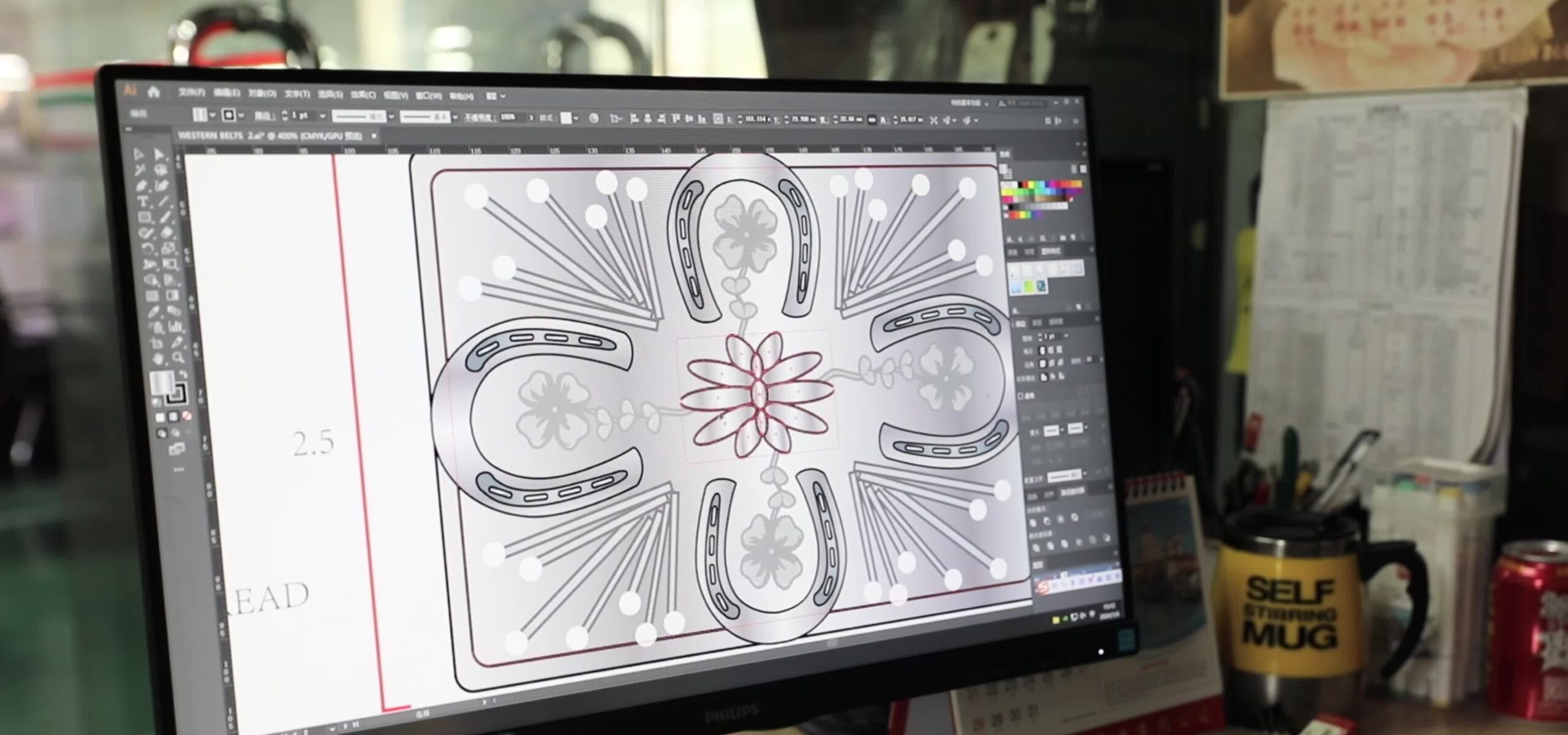 Belt artwork displayed on a designer's monitor at HongDing