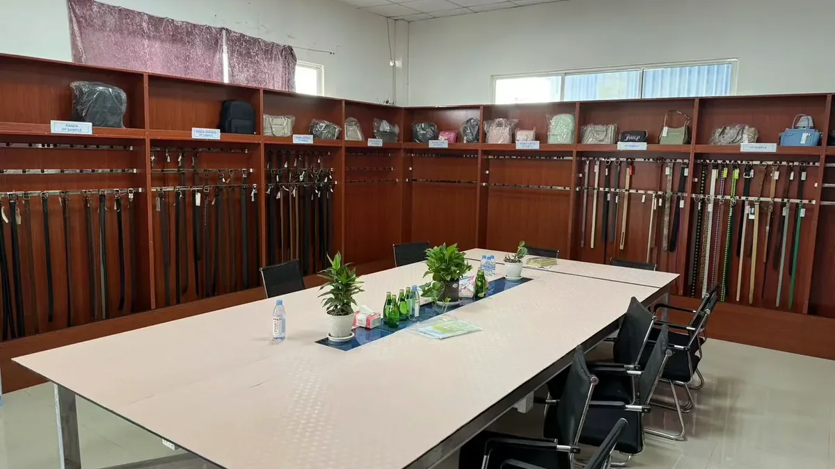 Supplier review meeting room with belt samples displayed on the wall